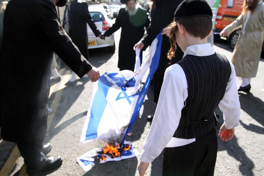 Ultra-Orthodox Anti-Zionist Jews Held an Israeli Flag Burning Protest ...