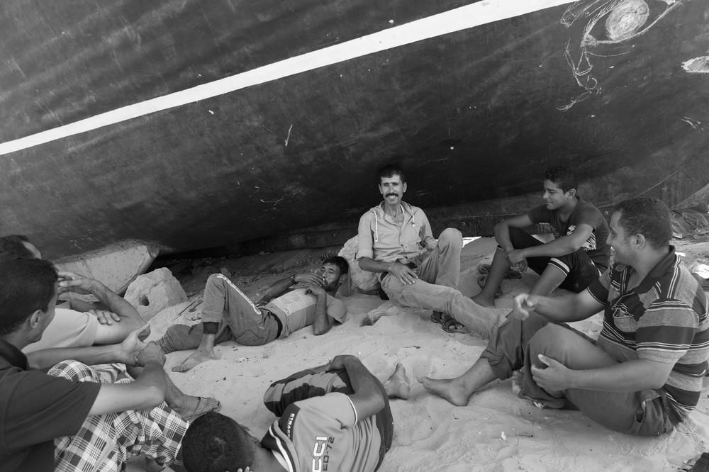 A group of fishermen resting after work. Drug dealers disguise themselves as fishermen when they go to buy the tablets at sea.